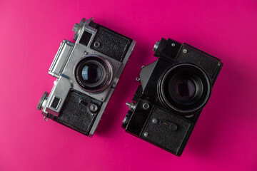 Old film camera on a colored background