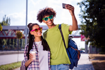 Photo of young african couple happy positive smile walk city make selfie cellphone drink milkshake summer outdoors