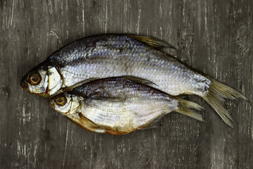 dried salted fish, beer snack, roach and rudd on a gray background