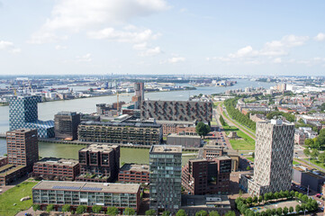 Aerial view of the Rotterdam skyline with in the background a lot of industry in the Netherlands
