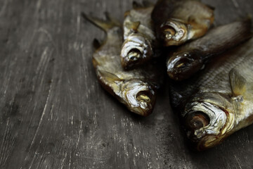 dried fish on a gray background close-up, beer snack