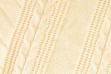 Beige knitted wool fabric texture top view