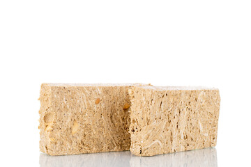 Two pieces of halva with peanuts , close-up, isolated on white.