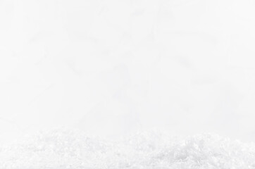 White soft light delicate fake snow and bright shiny snowflakes with blur as abstract fairy winter background. Festive christmas background for design, poster, card, flyer, brochure.