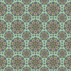 Geometric mandala seamless pattern on green