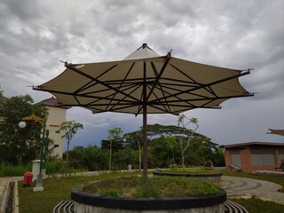 garden bench with umbrella-shaped roof