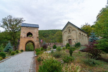 Fototapeta na wymiar Small church in the yard of the famous Kintsvisi monastery in Shida Kartli, central Georgia