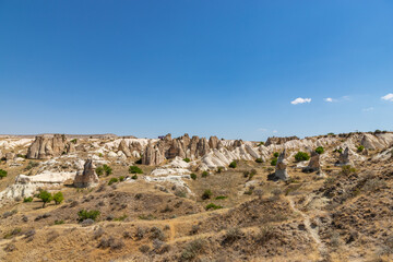 Fototapeta na wymiar Panorama of unique geological formations at Cappadocia at sunny day, Central Anatolia, Turkey.