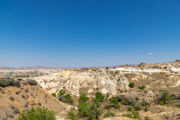 Panorama of unique geological formations at Cappadocia at sunny day, Central Anatolia, Turkey.