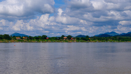 Fototapeta premium Houses on the riverside of Laos adjacent to Thailand.