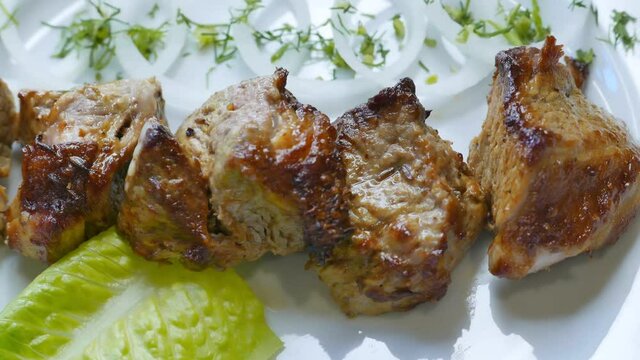 Tasty beef shish kebab barbecue on a plate ready for dinner.