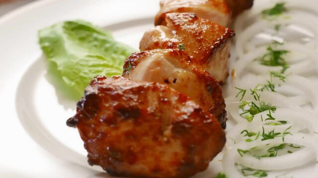Chicken barbecue shish kebab for dinner. Nice grilled meat food rotating