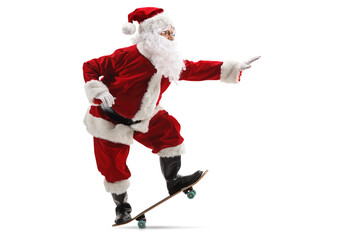 Full length profile shot of a happy santa claus riding a skateboard
