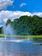 Rainbow in a fountain on a sunny day
