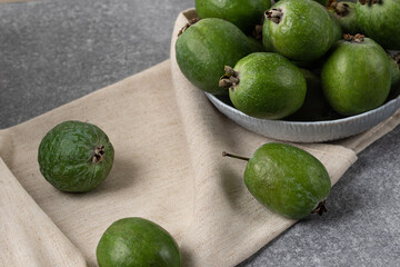 green feijoa berries for green smoothies. Natural antioxidant in ripe berries acca sellowiana, detox menu ingredient