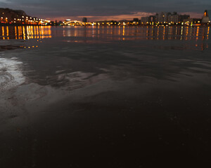 Fototapeta premium Evening lights in the city on the river
