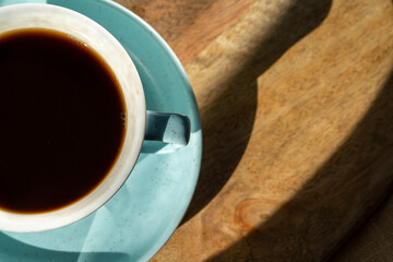Cup of coffee on wooden desk background ,close up.