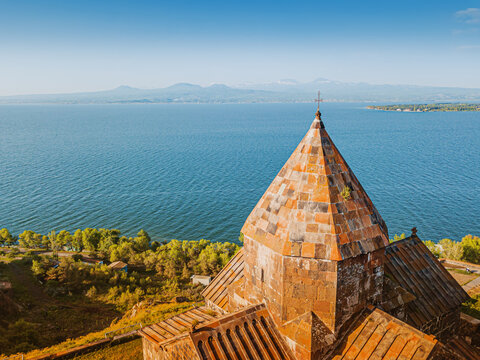 Air top view of Sevanavank Monastery and chapel and famous Sevan lake at sunny spring day. Travel and tourist destinations of Armenia