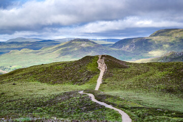 Hiking trail goes to wind turbines around Loch Ness in Scotland, UK