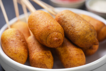 Stack of Corn dogs cooked with sausage and dough, - obrazy, fototapety, plakaty