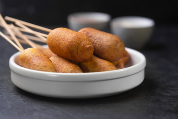 Corn dogs cooked with sausage and dough, horizontal - obrazy, fototapety, plakaty