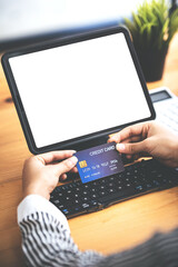 young woman holding credit card and using a laptop computer business woman working from home, online shopping, ecommerce, internet banking, spending money, finance, work from home concept..