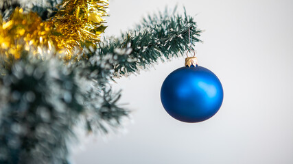 Frame of pine branch and Christmas balls on white background. Xmas decoration