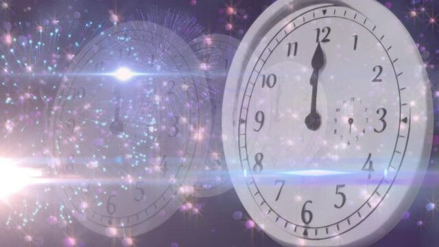 Animation of new year's eve clock showing midnight and glowing lights