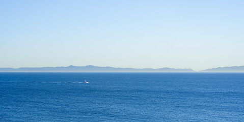 Panorama of Lake, Mountains, and Boat