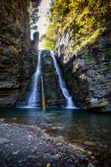 Beautiful waterfall among the canyon in the Carpathian mountains.