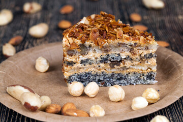 sweet cake with buttercream and sponge cake and lots of poppy seeds and nuts