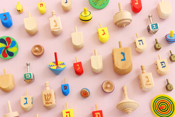 Image of jewish holiday Hanukkah and wooden dreidels collection. Spinning tops with letters that...