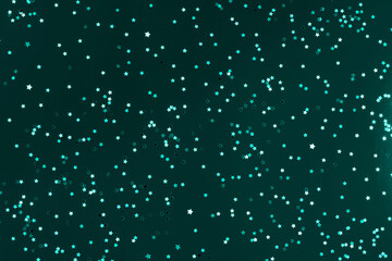 Festive blue green background with many many silver stars. Christmas, New Year or Birthday theme concept. An ideal backdrop for your banner or web design. Backplate for happy holidays presentation