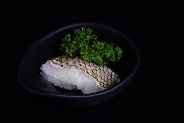 Traditional Japanese Food, Fresh Fish top on Rice,  
Sake  Nigiri Sushi , on Black Background