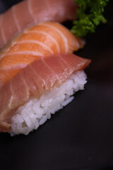 Traditional Japanese Food, Fresh Salmon top on Rice,  
Sake Nigiri Sushi , on Black Background