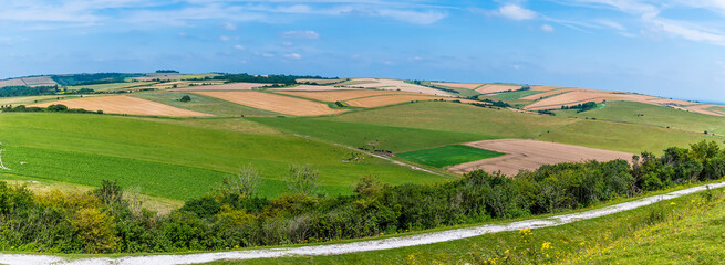 A panorama view of the patchwork fields on the South Downs above Worthing, Sussex in summertime