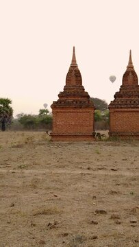 Sunrise in Old Bagan, Myanmar. Hot air balloons and temples