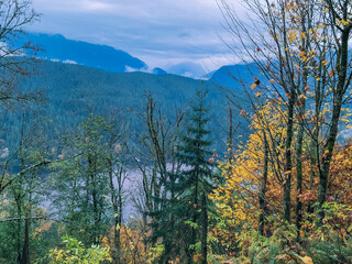 Burrard Inlet, BC, and North Shore mountains, seen from TransCanada Trail at Burnaby Mountain in Fall.
