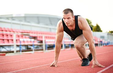 Millennial athletic muscular sportsman doing push ups in a fitness park outdoors - Focused male doing workout on the floor - Strength and bodybuilding concept