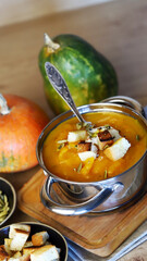 Delicious pumpkin soup in a saucepan.