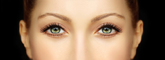 female eyes with makeup and long eyelashes