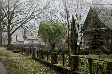 Late autumn in the village. Foggy cloudy day.