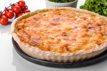 Delicious fresh quiche with broccoli, salmon and cheese