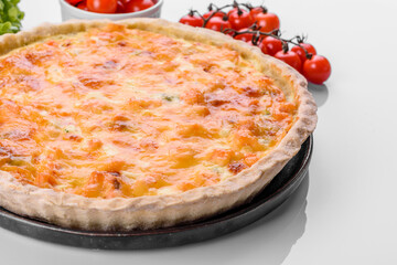 Delicious fresh quiche with broccoli, salmon and cheese