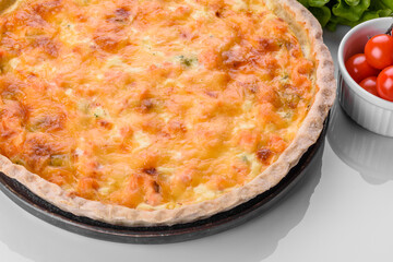 Delicious fresh quiche with broccoli, salmon and cheese
