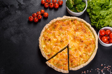 Delicious fresh quiche with broccoli, salmon and cheese