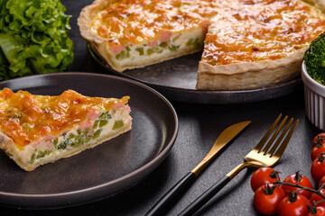 Delicious fresh quiche with broccoli, salmon and cheese