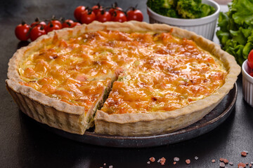 Delicious fresh quiche with broccoli, salmon and cheese