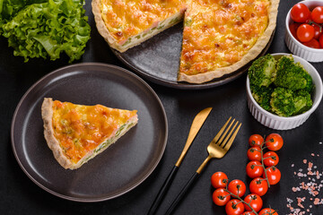 Delicious fresh quiche with broccoli, salmon and cheese