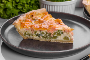 Delicious fresh quiche with broccoli, salmon and cheese